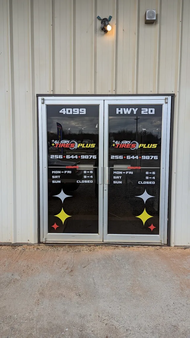 Storefront window hours and logo